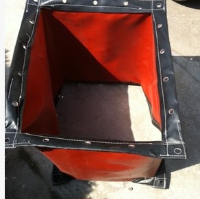 Non-metallic flexible fabric compensator